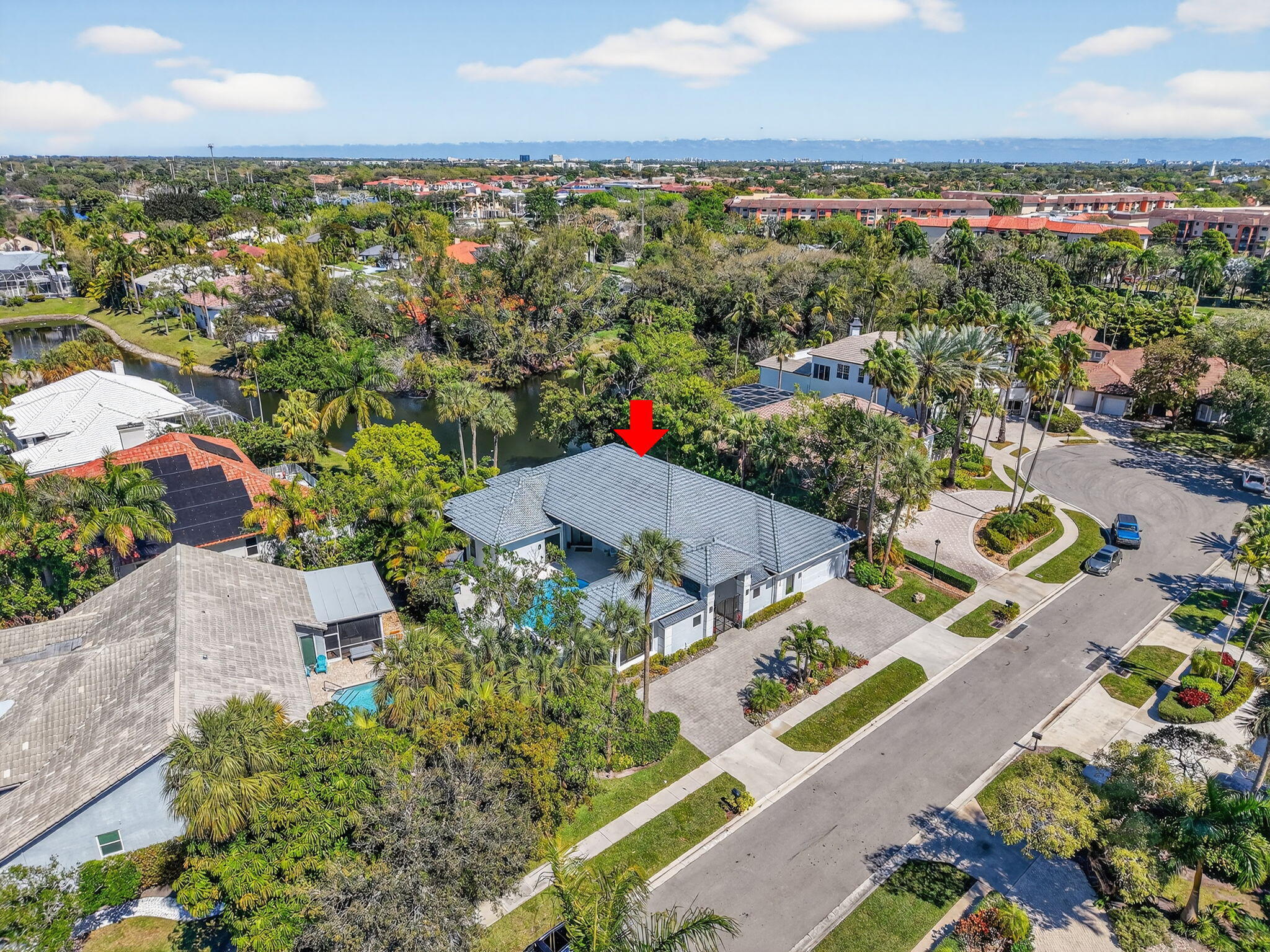 7075 Siena Court Boca Raton, FL 33433 - Photo 49 of 50 an aerial view of a city with lots of residential buildings ocean and mountain view in back