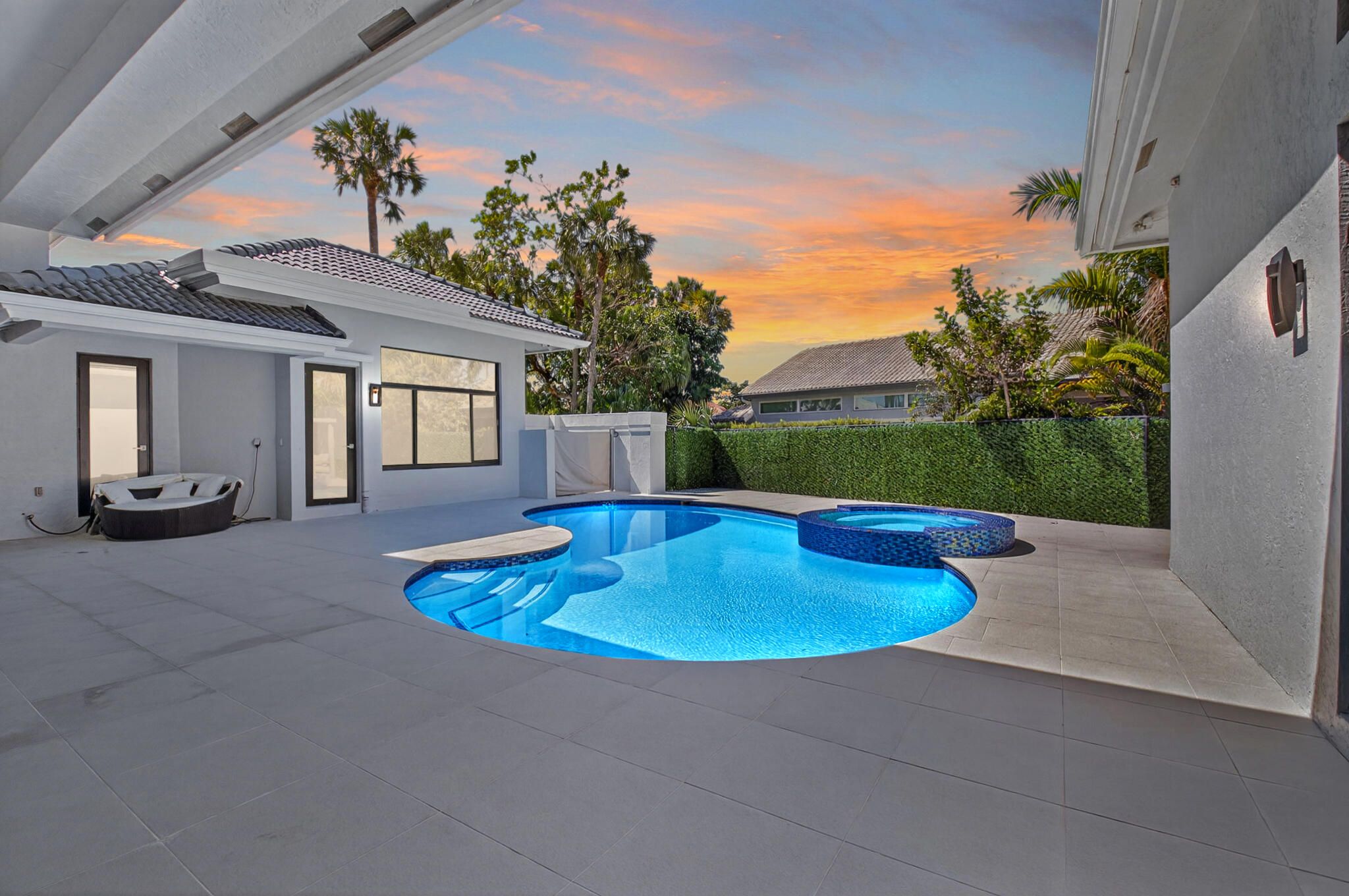 7075 Siena Court Boca Raton, FL 33433 - Photo 9 of 50 a swimming pool with outdoor seating and yard