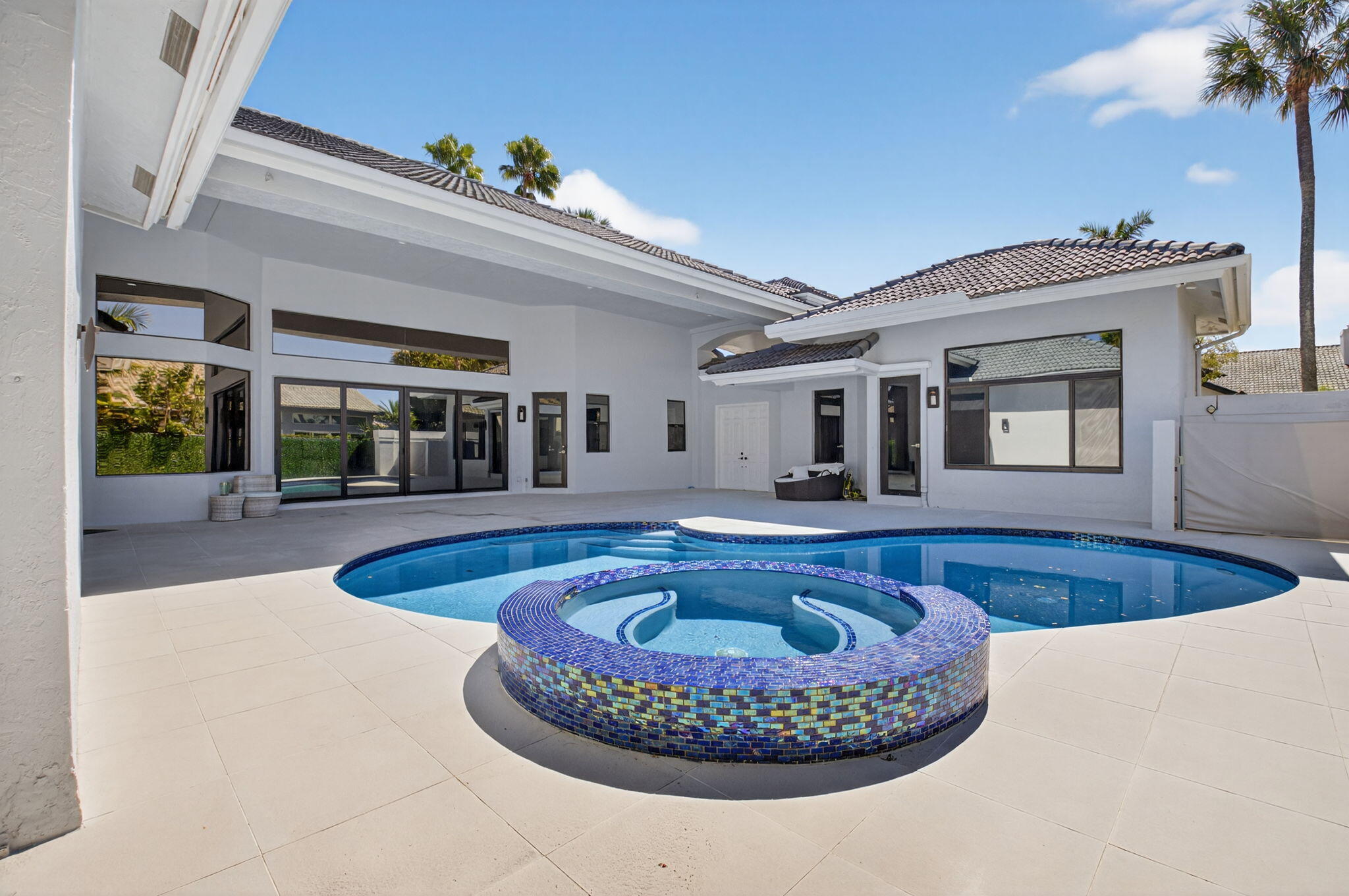 7075 Siena Court Boca Raton, FL 33433 - Photo 10 of 50 a swimming pool with outdoor seating