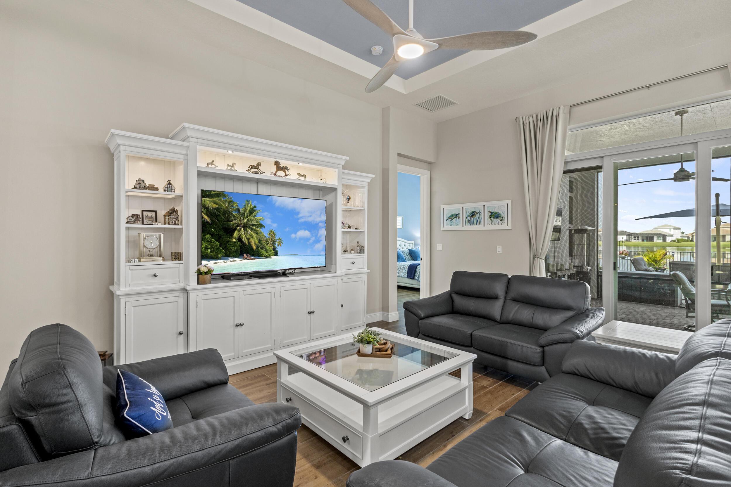 9242 Southwest Pepoli Way Port St. Lucie, FL 34987 - Photo 15 of 71 a living room with furniture and a flat screen tv