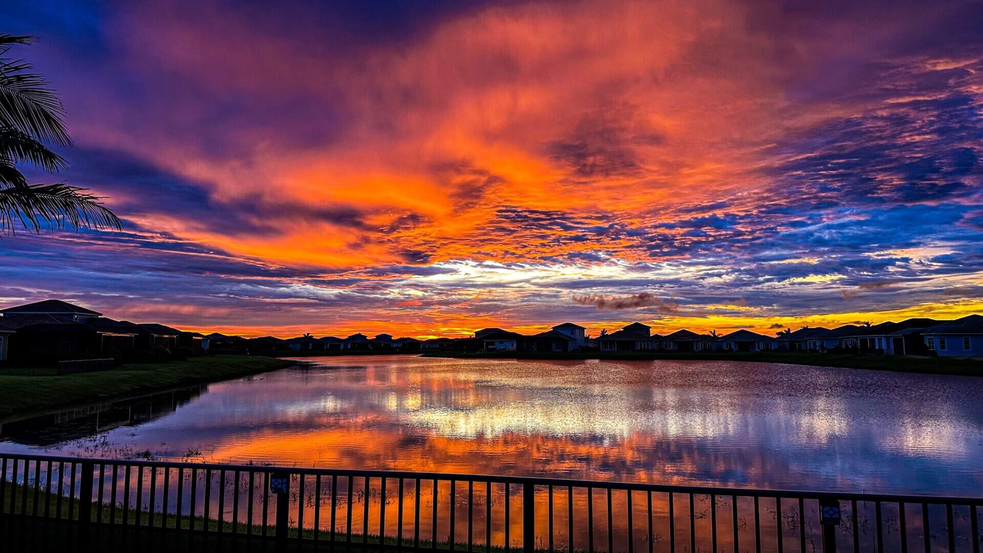 9242 Southwest Pepoli Way Port St. Lucie, FL 34987 - Photo 2 of 71 a view of lake from sunset