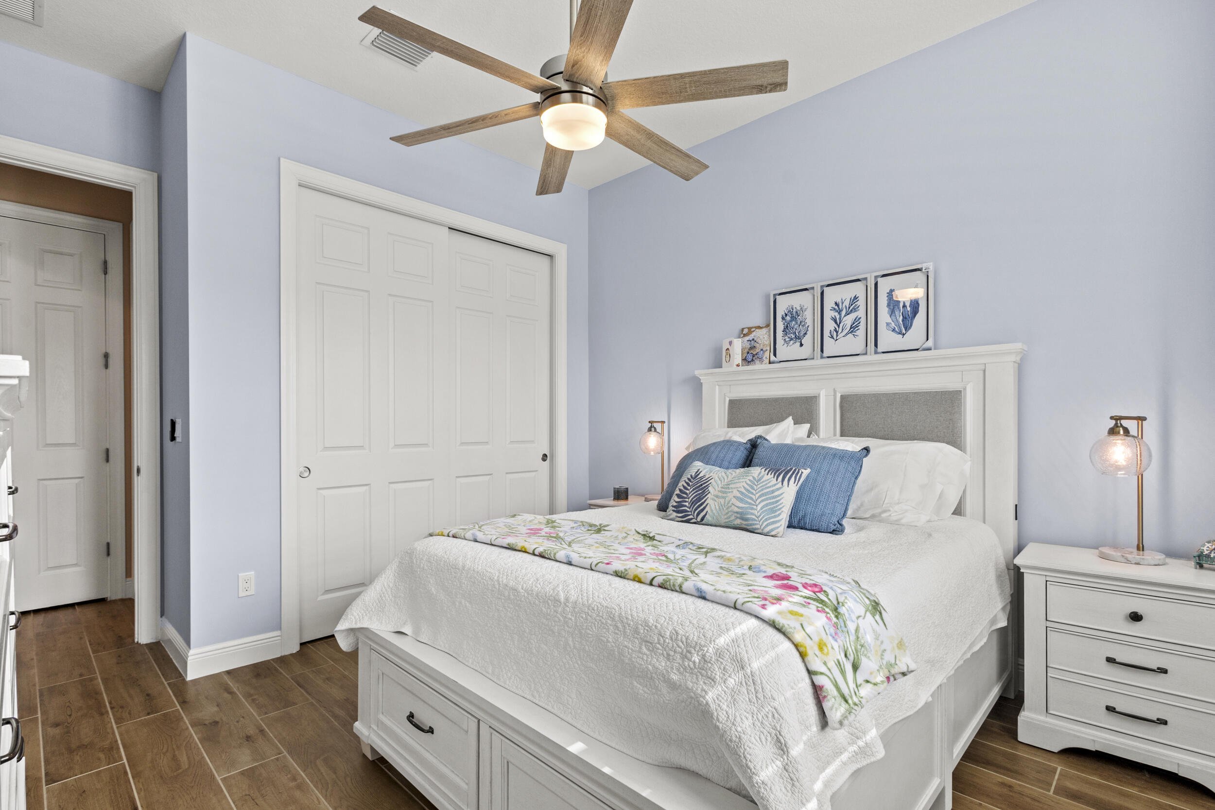 9242 Southwest Pepoli Way Port St. Lucie, FL 34987 - Photo 27 of 71 a bedroom with a bed and a dresser