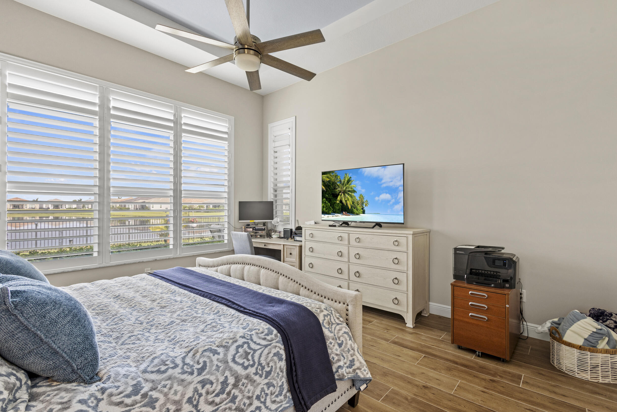 9242 Southwest Pepoli Way Port St. Lucie, FL 34987 - Photo 29 of 71 a bedroom with a bed and a flat screen tv