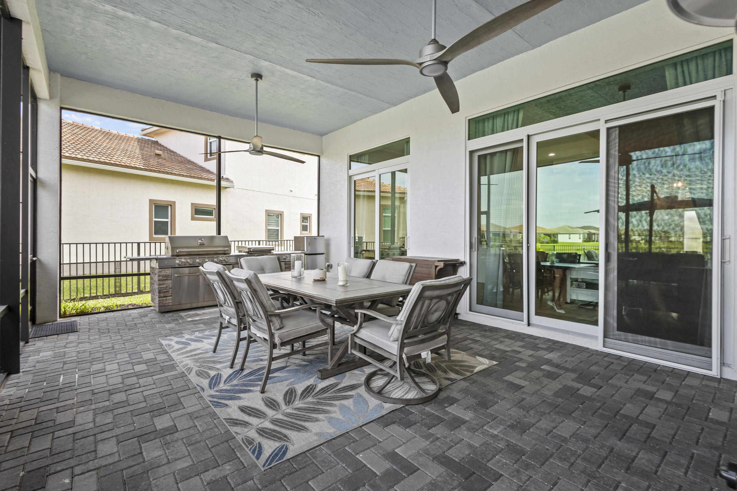 9242 Southwest Pepoli Way Port St. Lucie, FL 34987 - Photo 41 of 71 a view of a dining room with furniture and front door