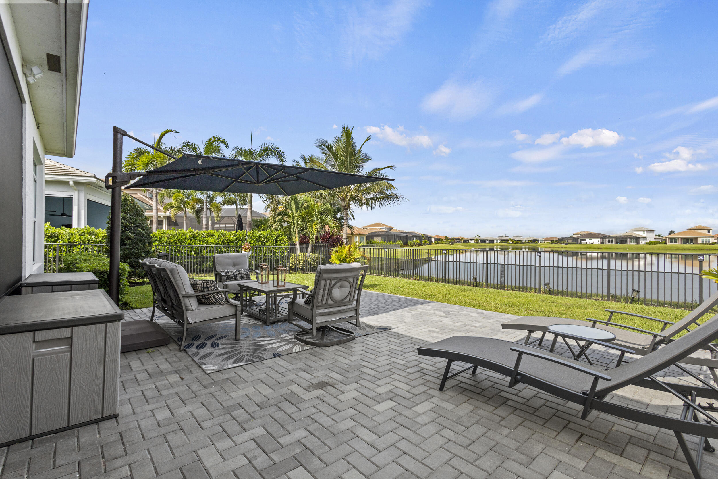 9242 Southwest Pepoli Way Port St. Lucie, FL 34987 - Photo 42 of 71 a view of swimming pool with lounge chairs