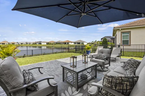 an aerial view of residential house with outdoor space and swimming pool