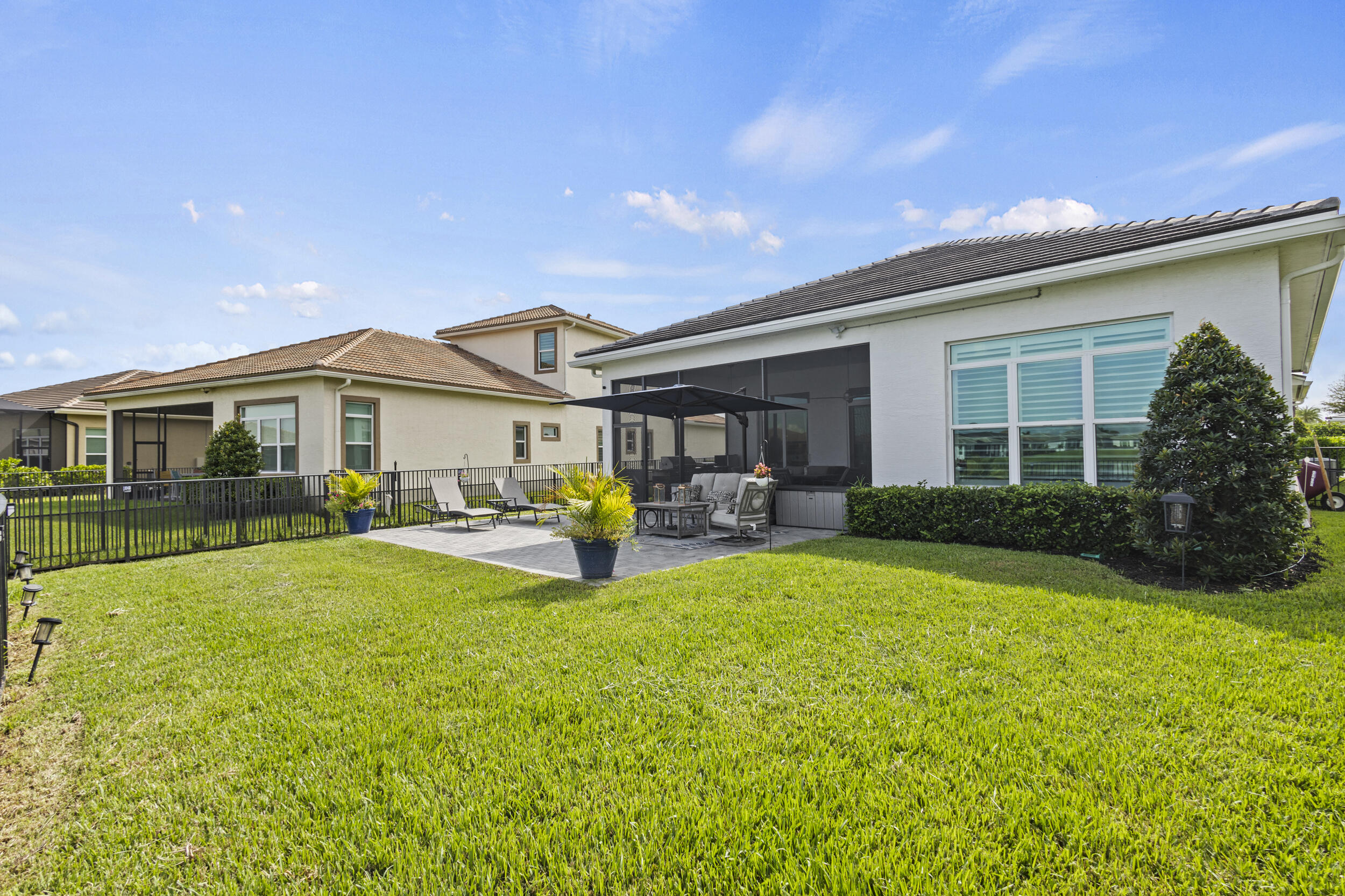 9242 Southwest Pepoli Way Port St. Lucie, FL 34987 - Photo 50 of 71 a view of a house with sitting area and garden