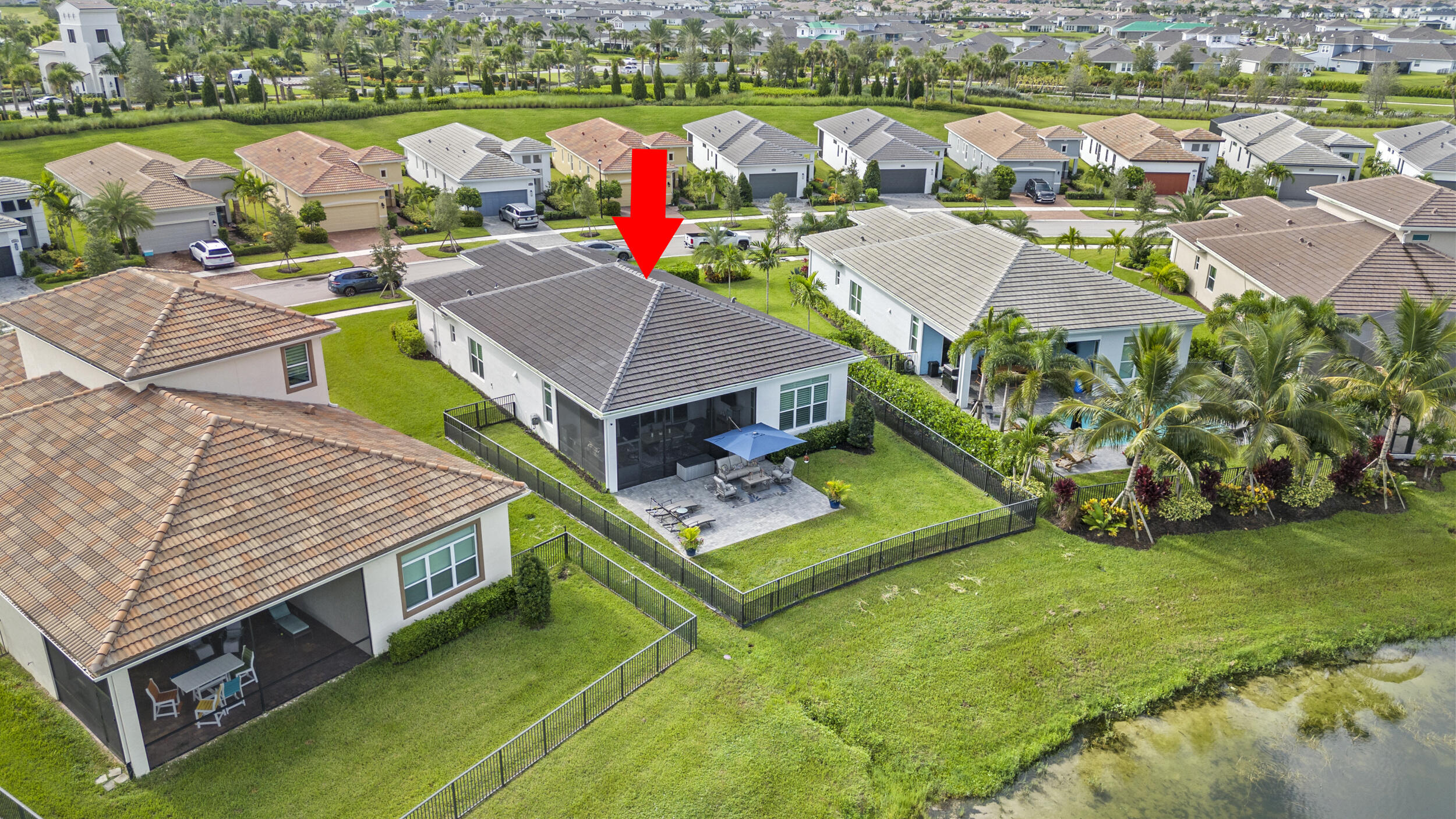 9242 Southwest Pepoli Way Port St. Lucie, FL 34987 - Photo 55 of 71 an aerial view of a house with a garden and lake view