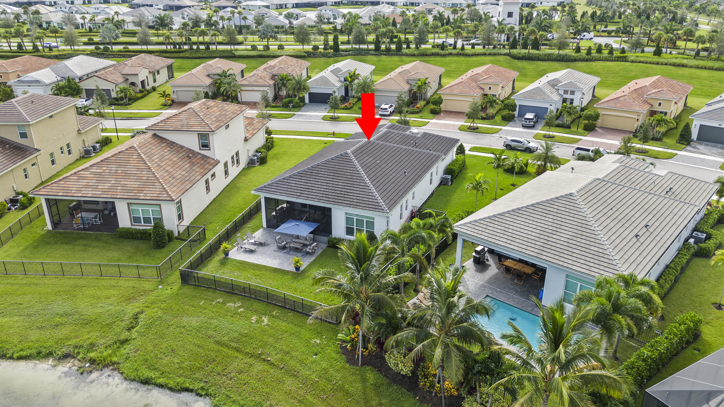 9242 Southwest Pepoli Way Port St. Lucie, FL 34987 - Photo 56 of 71 an aerial view of a house with a garden and lake view