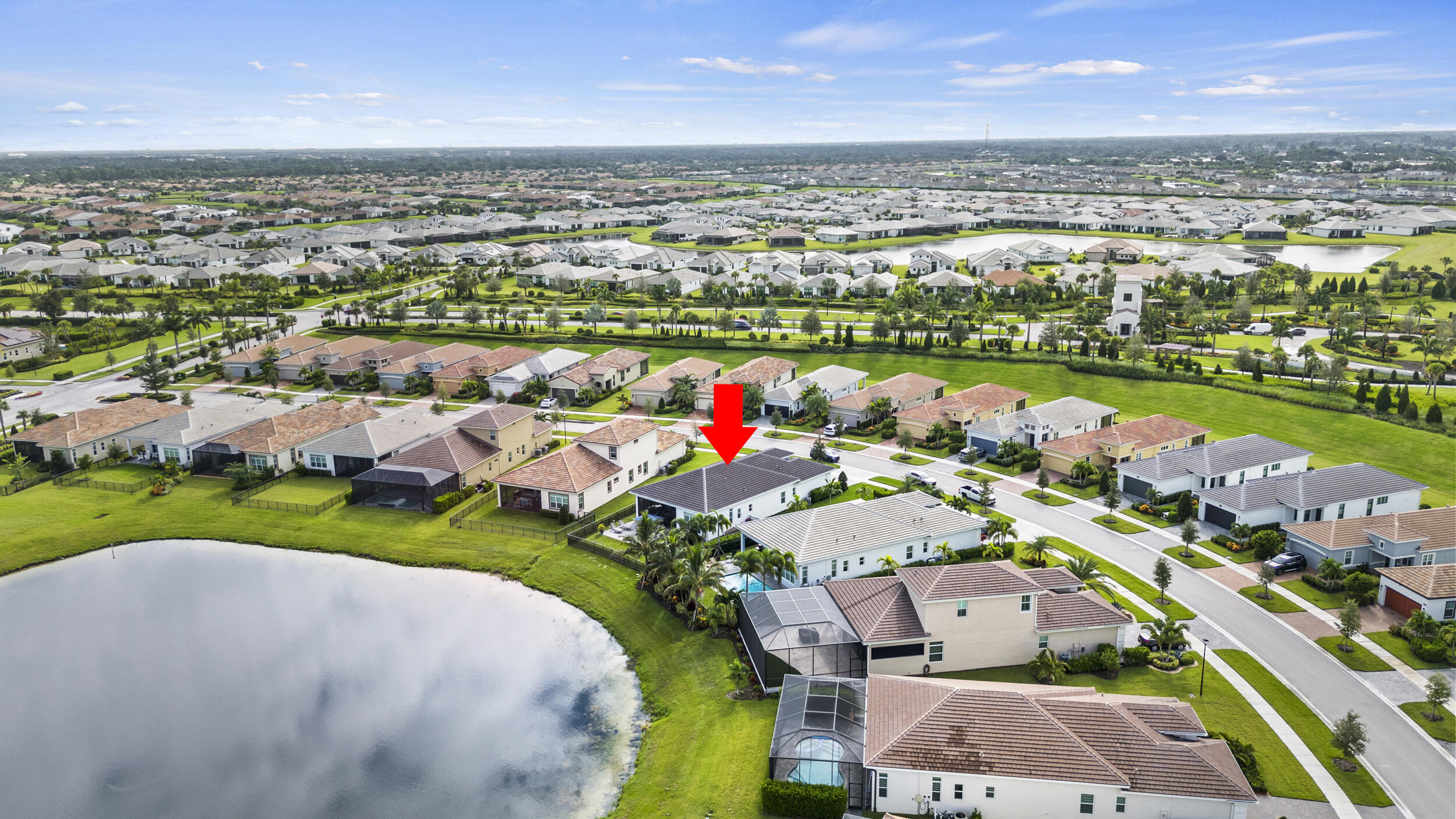 9242 Southwest Pepoli Way Port St. Lucie, FL 34987 - Photo 58 of 71 an aerial view of a house with a lake view