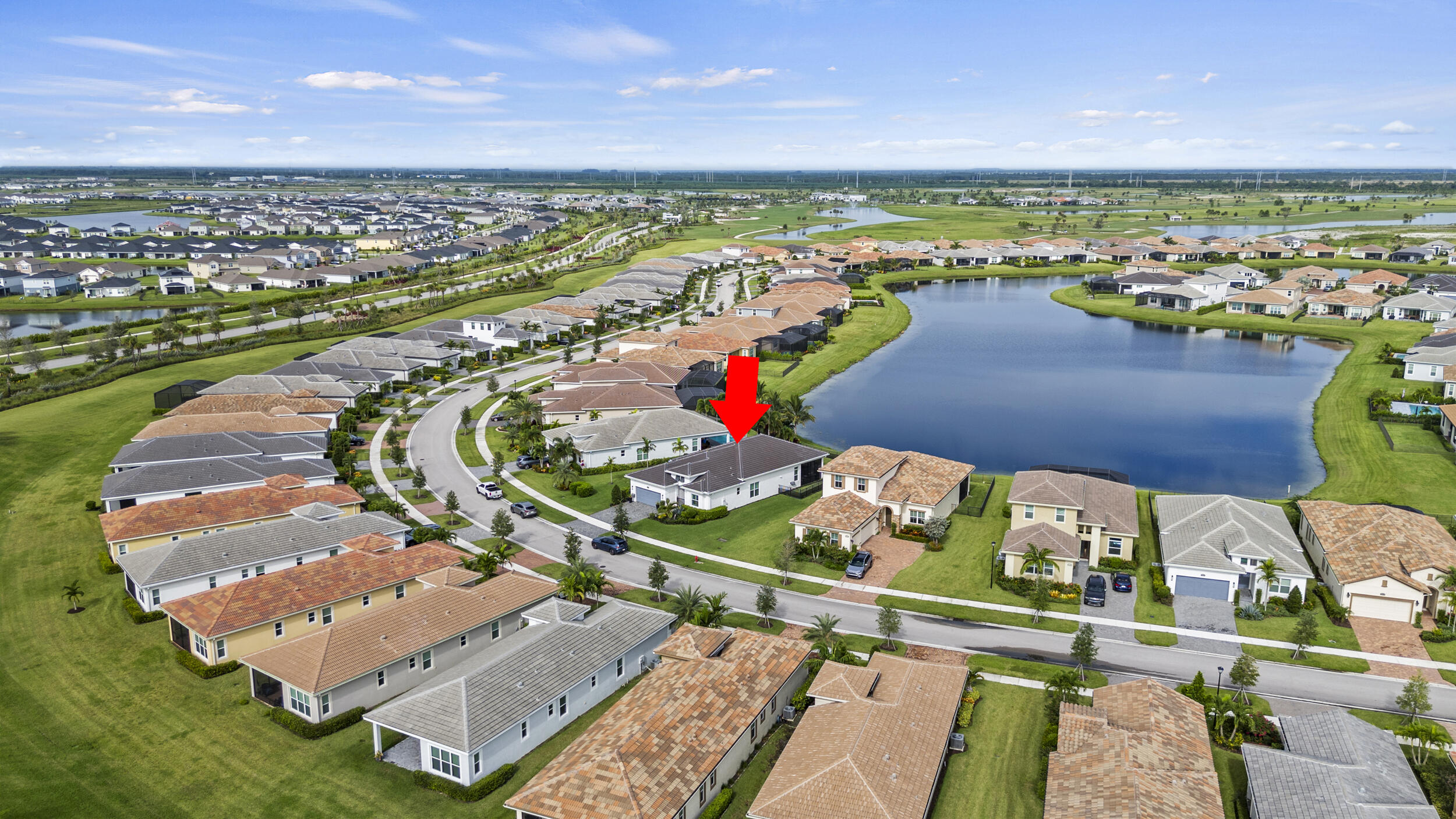 9242 Southwest Pepoli Way Port St. Lucie, FL 34987 - Photo 60 of 71 an aerial view of a house with a ocean view