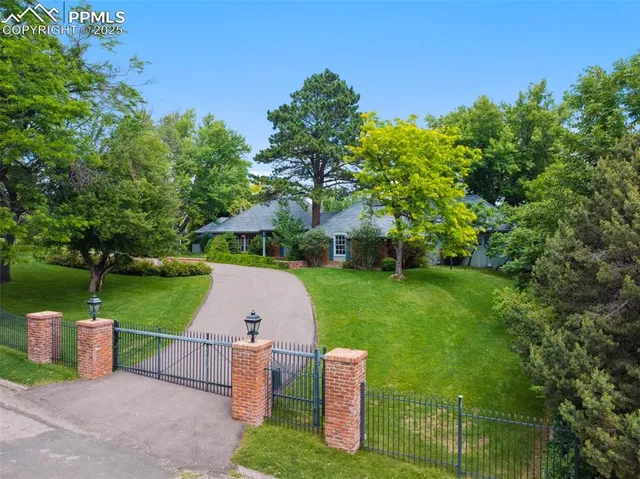 a view of a table and chairs under an umbrella