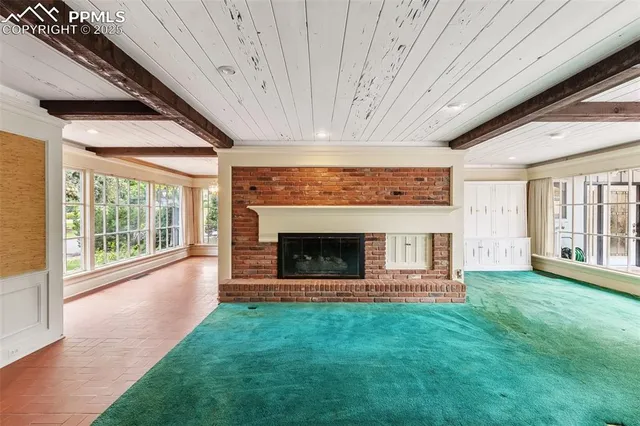 a view of room with window and chandelier