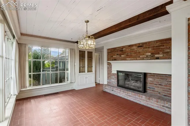 a kitchen with stainless steel appliances granite countertop a refrigerator and a stove
