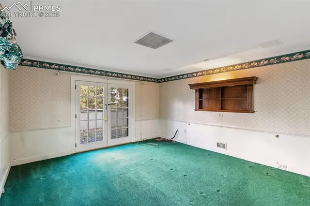 a kitchen with kitchen island a large counter top space and stainless steel appliances