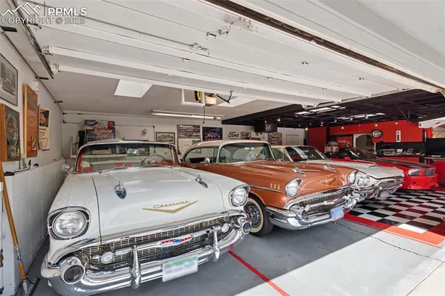 a view of a house with a yard and potted plants