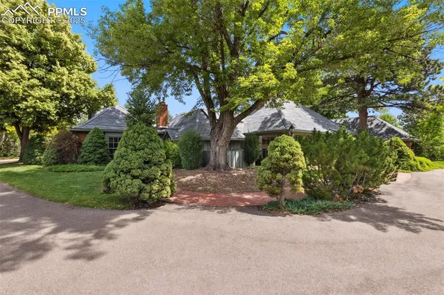 a backyard of a house with lots of green space