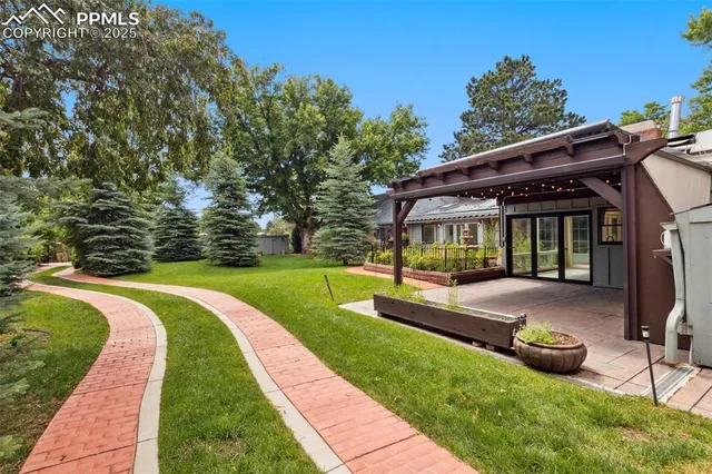 an aerial view of a house with mountain view
