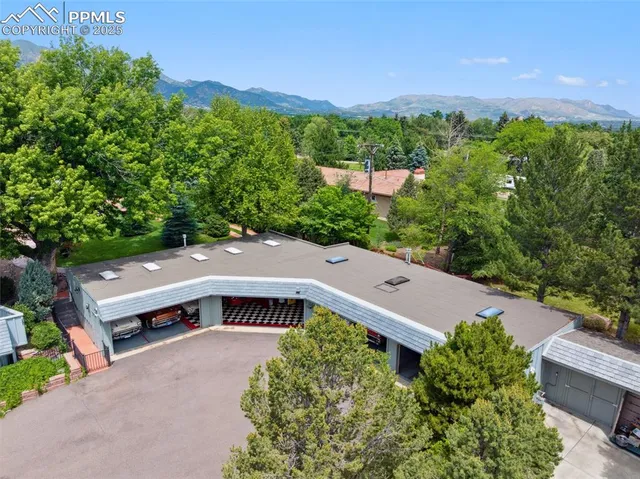 a view of a lush green hillside and houses