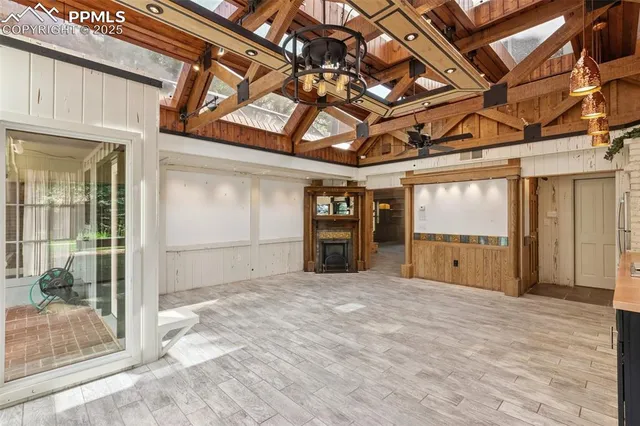 a view of a room with wooden walls