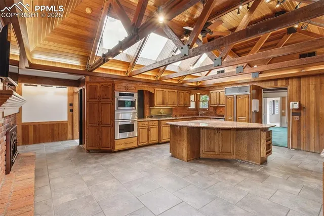 a kitchen with a stove and a refrigerator