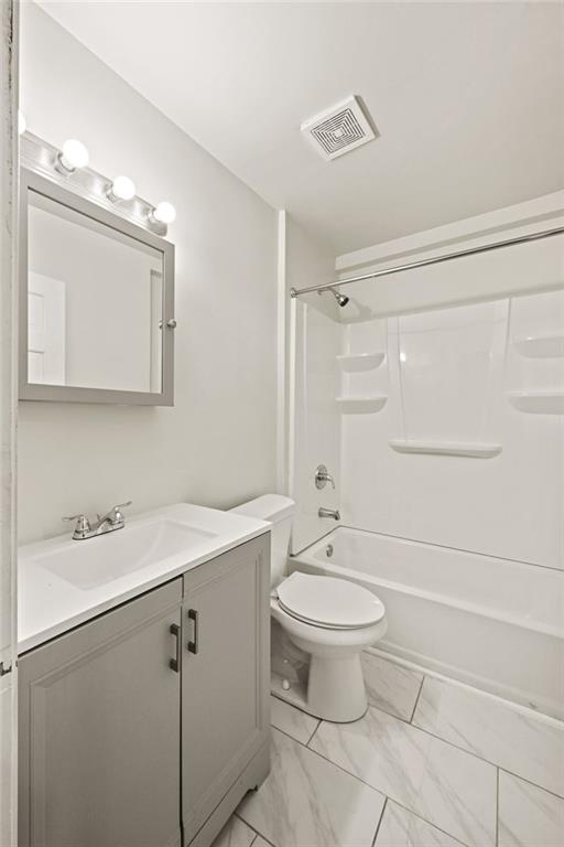 759 Smyrna Road Southwest Conyers, GA 30094 - Photo 15 of 25 a bathroom with a sink toilet and shower