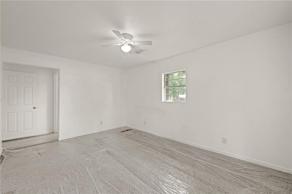 759 Smyrna Road Southwest Conyers, GA 30094 - Photo 19 of 25 a view of empty room with window