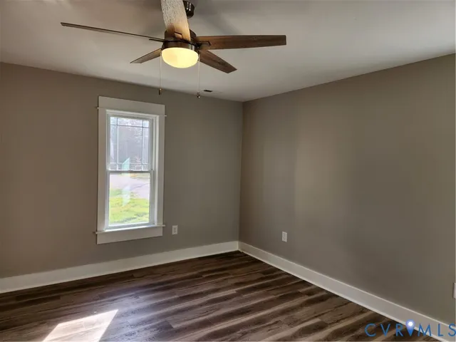 a view of walk in closet with wooden floor