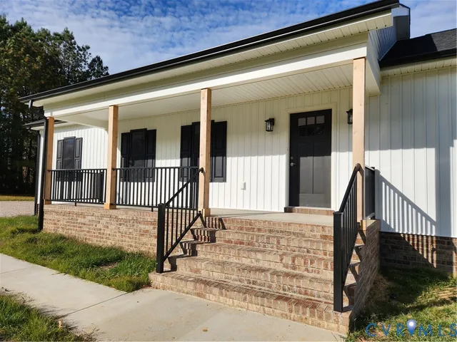 front view of a house with a small yard