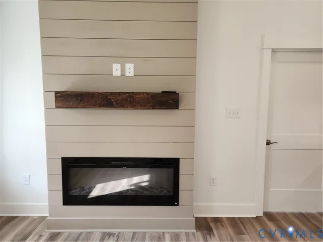 a view of a livingroom with furniture and chandelier fan