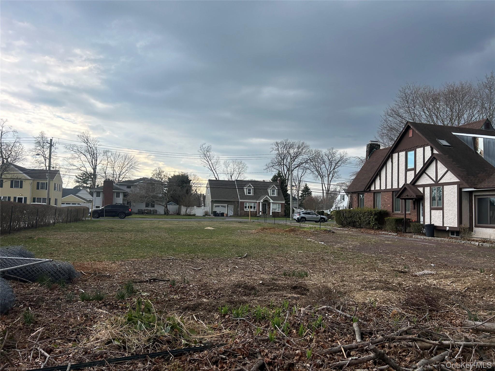 Sunset Road Bay Shore, NY 11706 - Photo 3 of 6 a view of a big house with a big yard and large trees