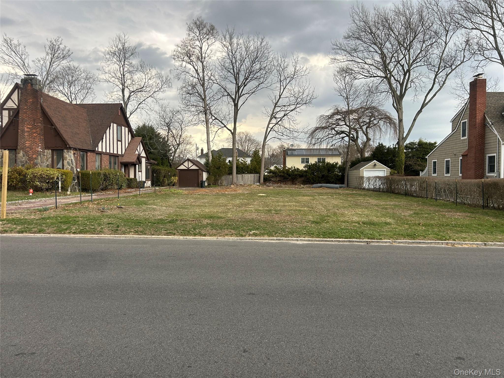 Sunset Road Bay Shore, NY 11706 - Photo 5 of 6 a view of a town with large trees