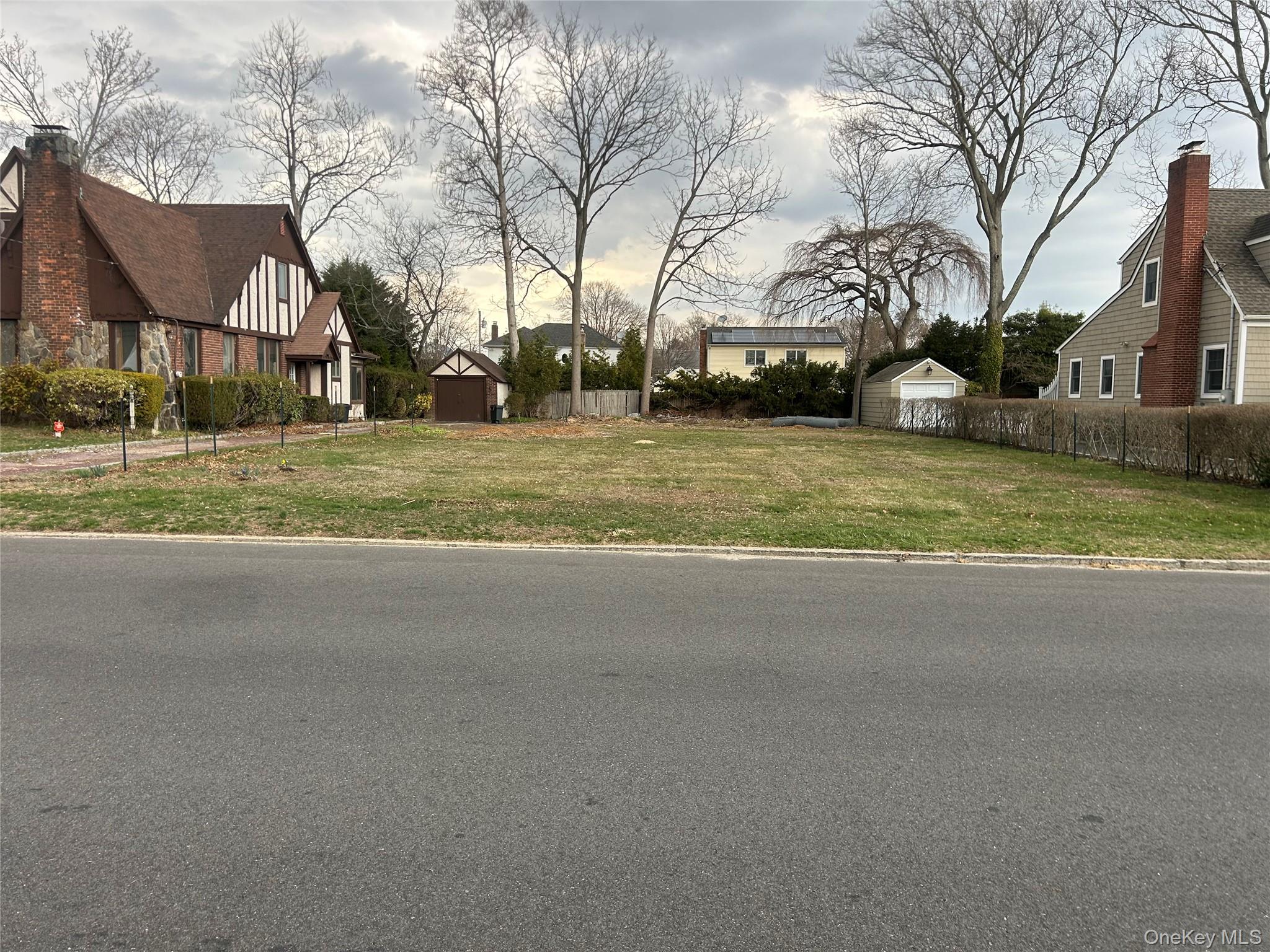 Sunset Road Bay Shore, NY 11706 - Photo 6 of 6 a view of road with large trees