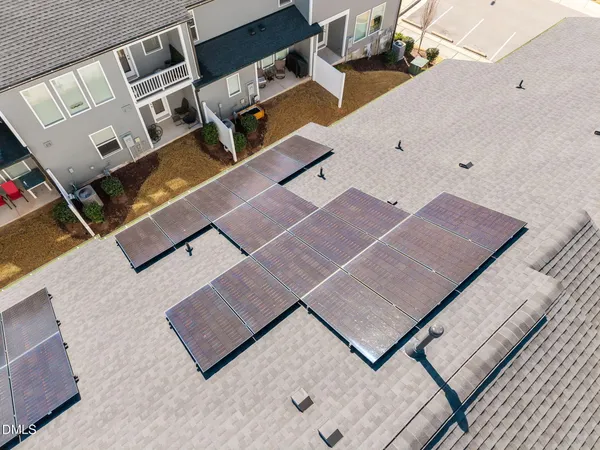 an aerial view of residential houses with outdoor space