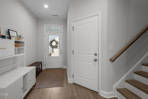 a hallway with windows and stairs