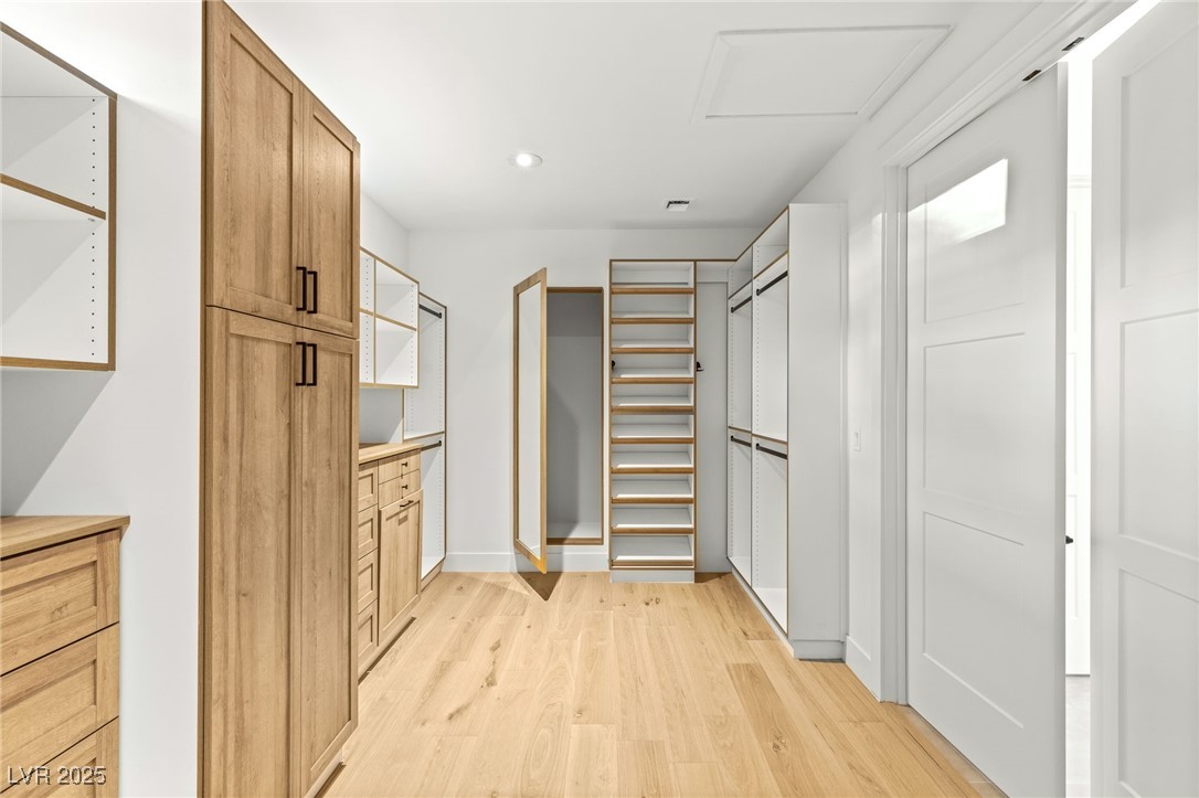 2316 Prometheus Court Henderson, NV 89074 - Photo 35 of 92 Walk in closet featuring light wood-style floors and attic access