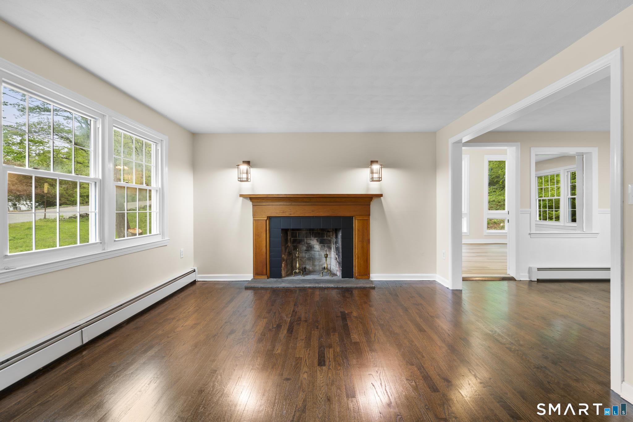 7 Sycamore Terrace Windham, CT 06280 - Photo 4 of 40 wooden floor fireplace and windows in an empty room