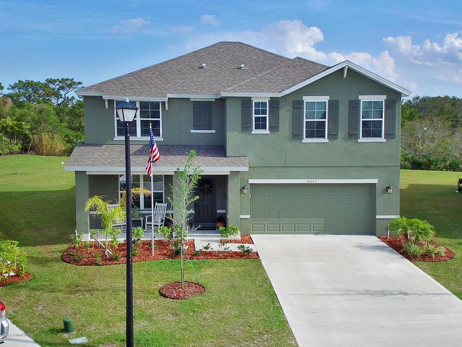 4637 Amaca Bay Lane Melbourne, FL 32935 - Photo 1 of 52 a front view of house with yard and outdoor seating