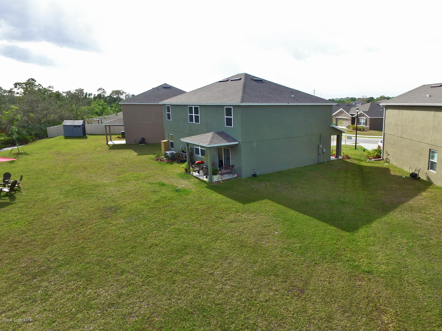 4637 Amaca Bay Lane Melbourne, FL 32935 - Photo 2 of 52 a view of a house with a yard and sitting area