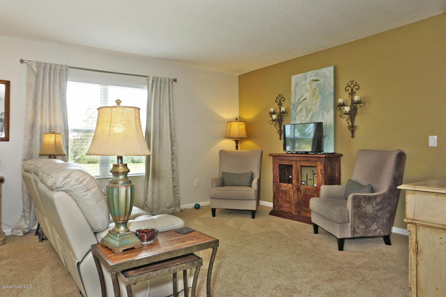 4637 Amaca Bay Lane Melbourne, FL 32935 - Photo 13 of 52 a living room with furniture and a table