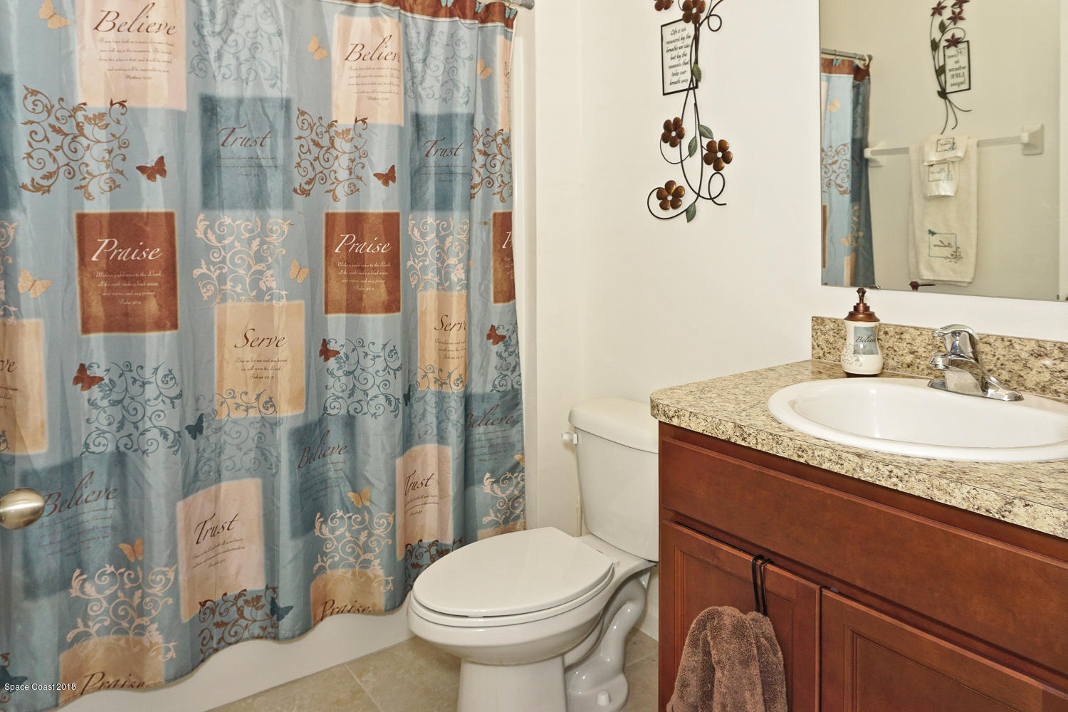 4637 Amaca Bay Lane Melbourne, FL 32935 - Photo 16 of 52 a bathroom with a granite countertop sink toilet and shower