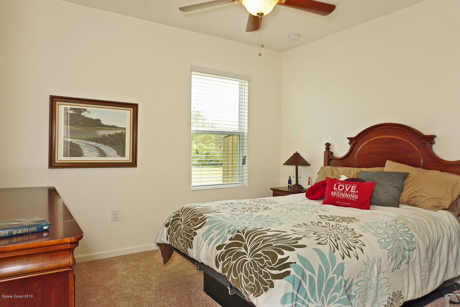4637 Amaca Bay Lane Melbourne, FL 32935 - Photo 17 of 52 a bedroom with a bed and a window