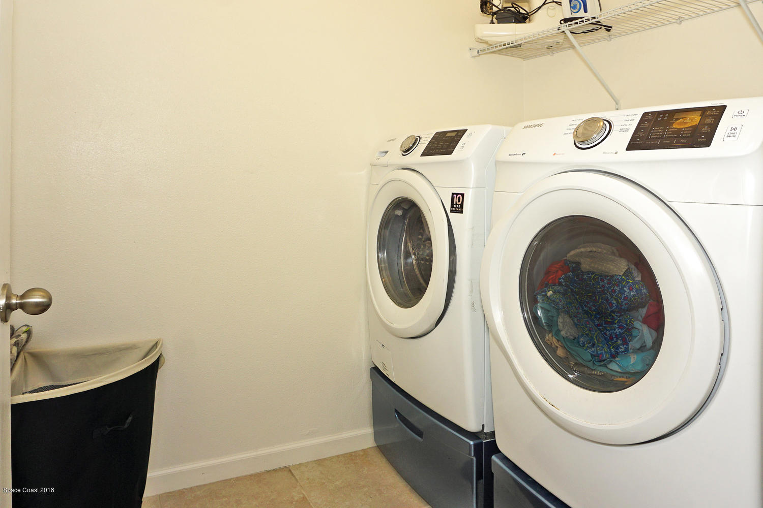 4637 Amaca Bay Lane Melbourne, FL 32935 - Photo 19 of 52 a utility room with dryer and washer