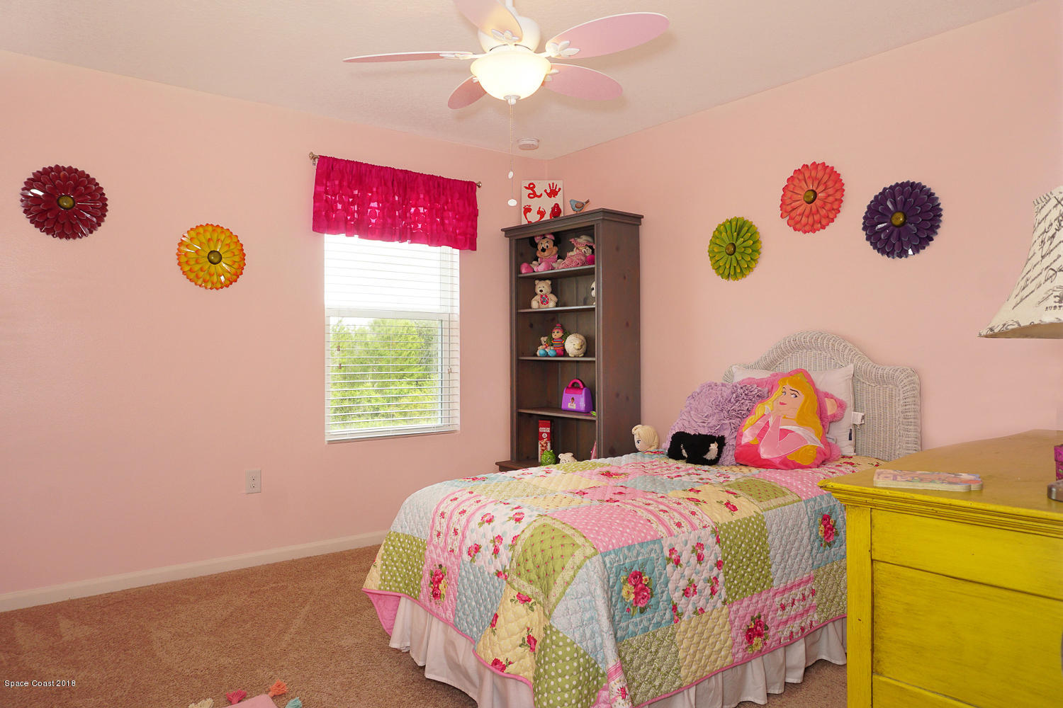 4637 Amaca Bay Lane Melbourne, FL 32935 - Photo 20 of 52 a bedroom with a bed and a window
