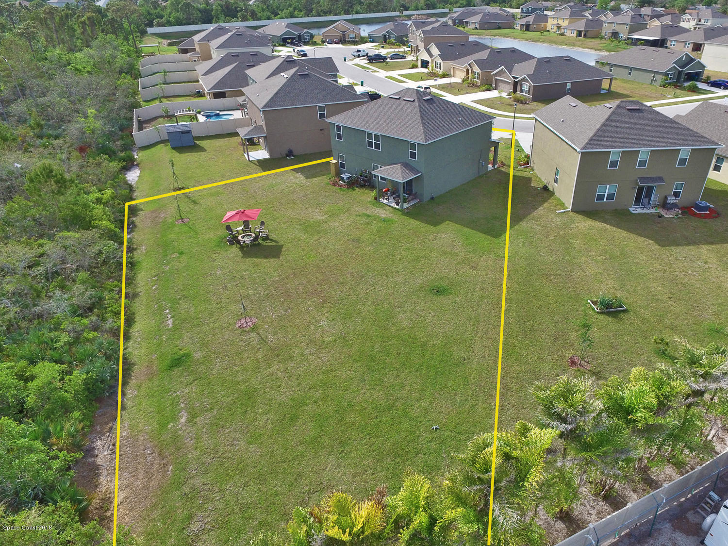 4637 Amaca Bay Lane Melbourne, FL 32935 - Photo 3 of 52 a aerial view of a house with a garden
