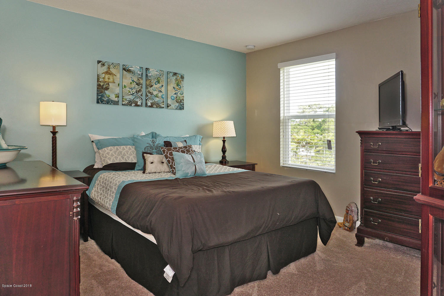 4637 Amaca Bay Lane Melbourne, FL 32935 - Photo 22 of 52 a bedroom with a bed and a window