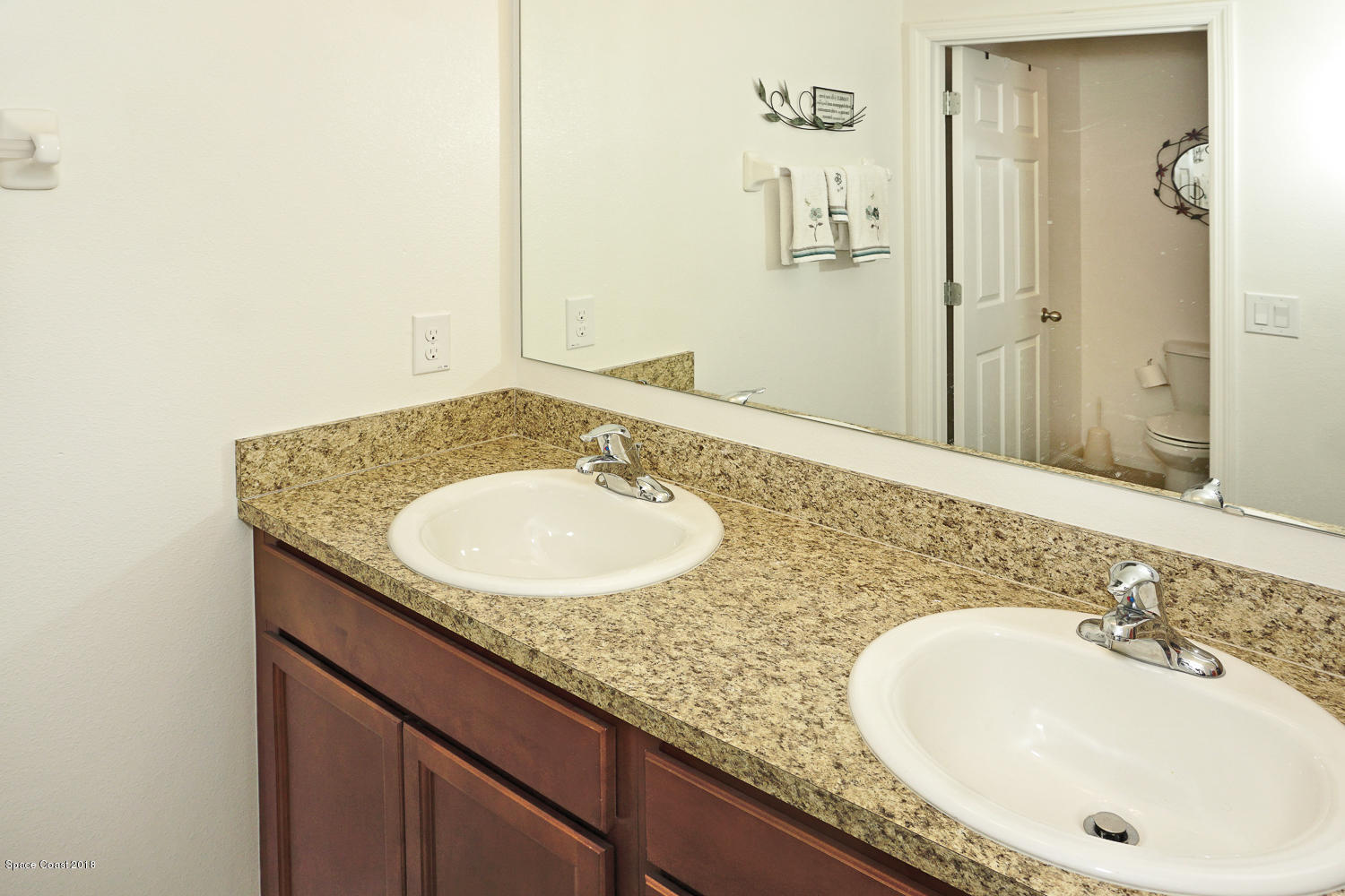 4637 Amaca Bay Lane Melbourne, FL 32935 - Photo 23 of 52 a bathroom with a granite countertop sink and a mirror