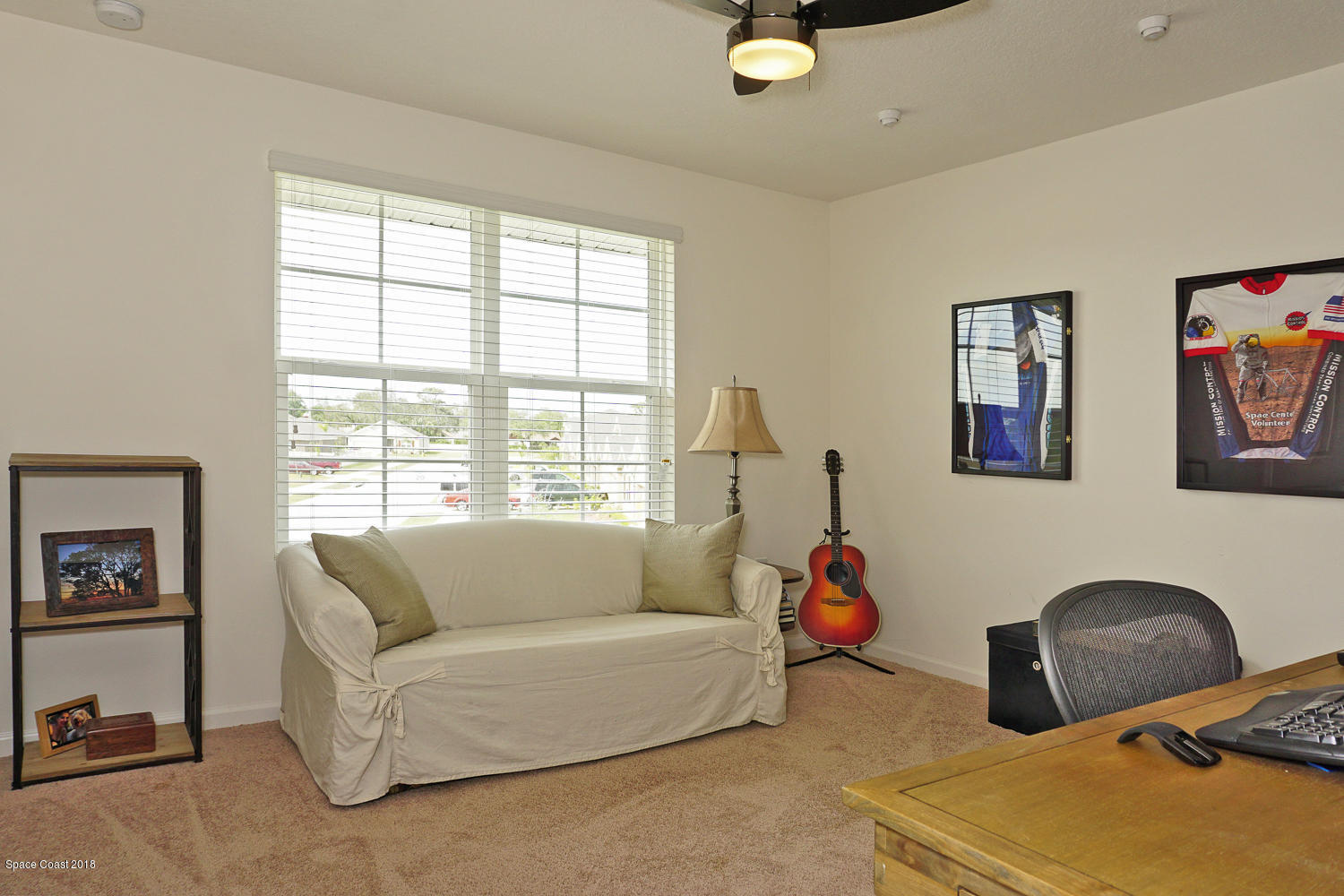 4637 Amaca Bay Lane Melbourne, FL 32935 - Photo 25 of 52 a living room with furniture and a window