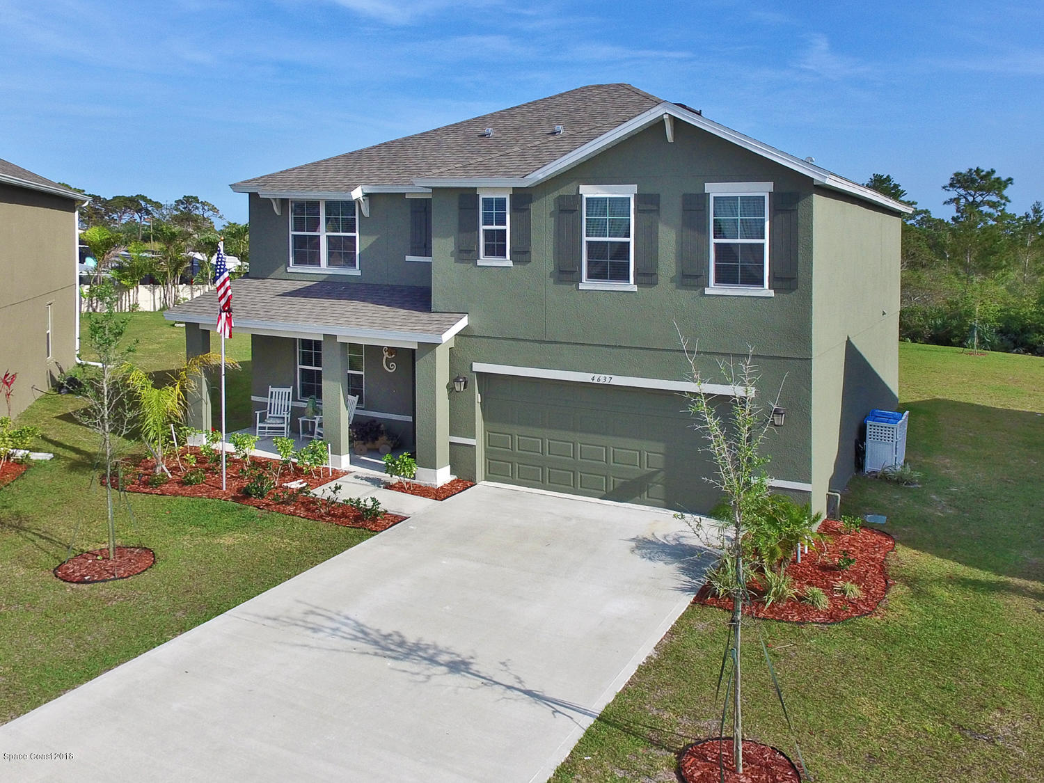 4637 Amaca Bay Lane Melbourne, FL 32935 - Photo 26 of 52 a front view of a house with a yard and porch