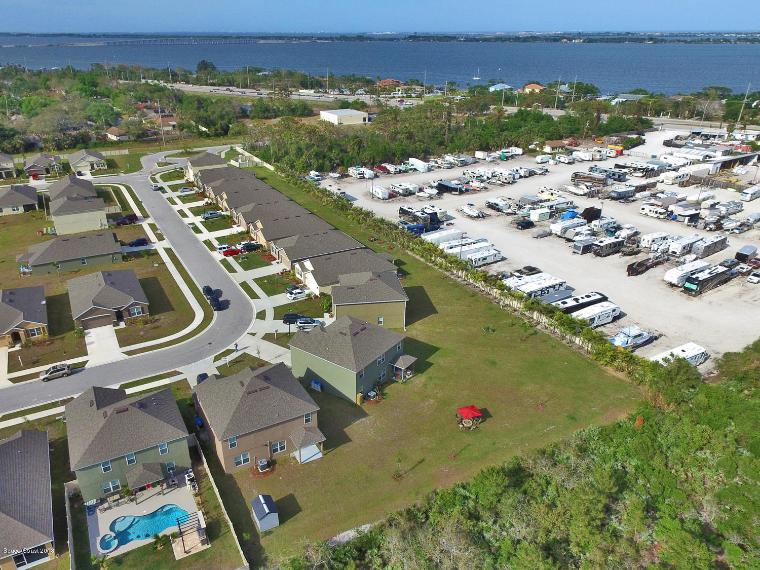 4637 Amaca Bay Lane Melbourne, FL 32935 - Photo 27 of 52 an aerial view of residential houses with outdoor space